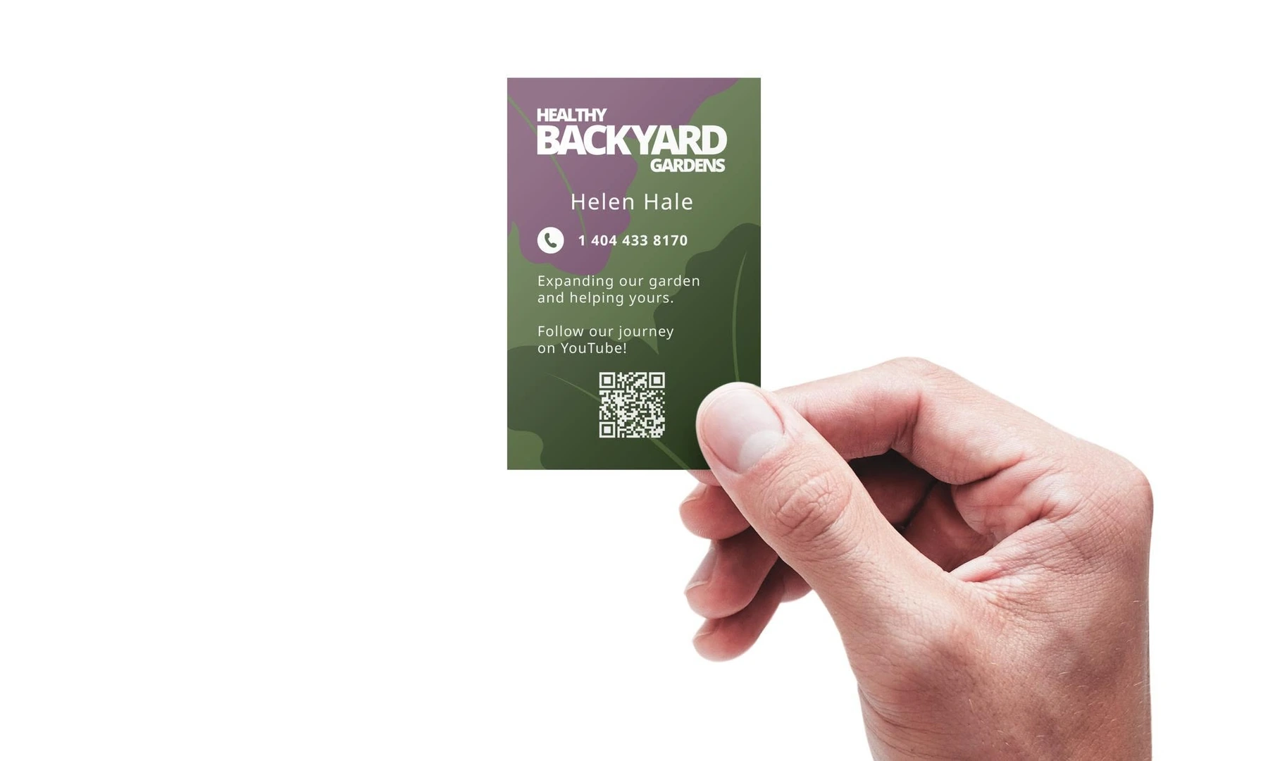 Healthy Backyard Gardens business card held in hand