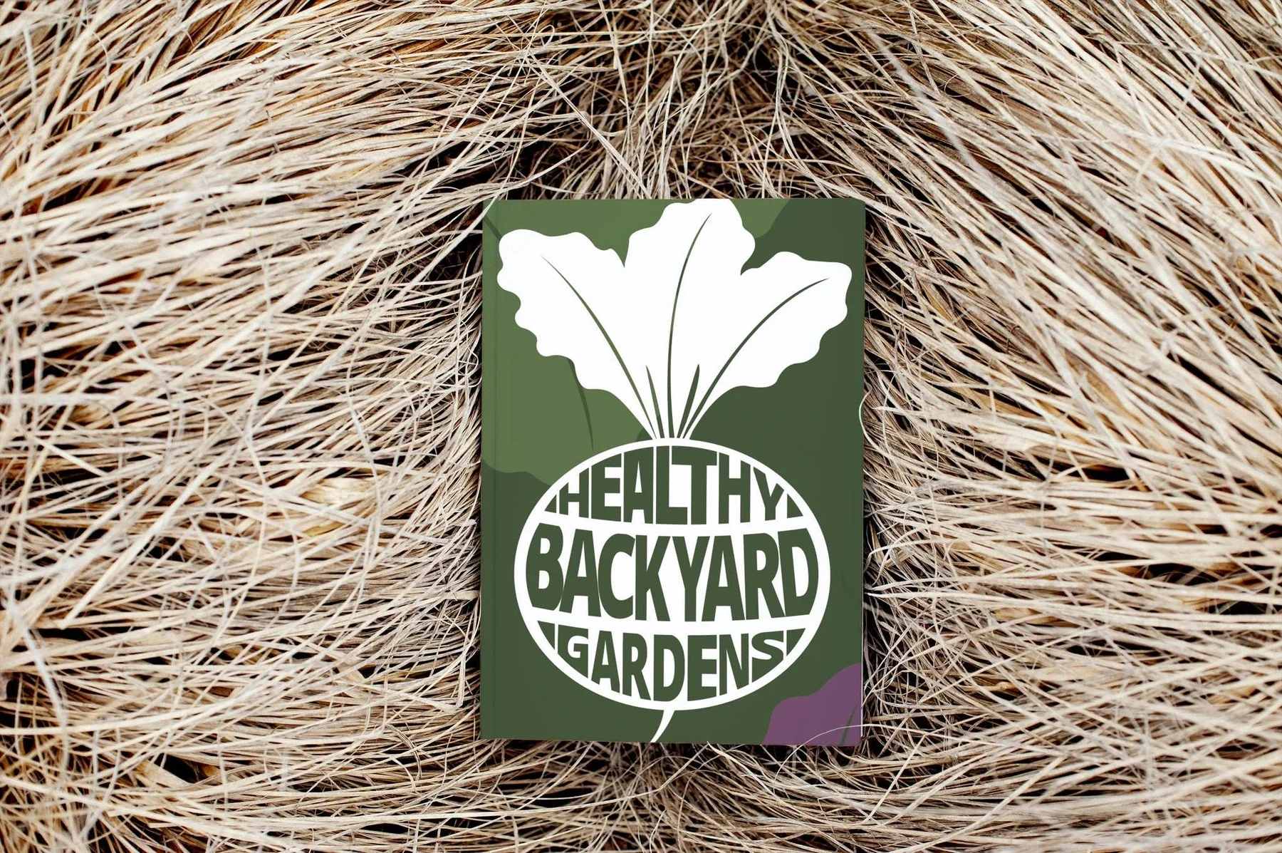 Healthy Backyard Gardens brand card presented on natural straw